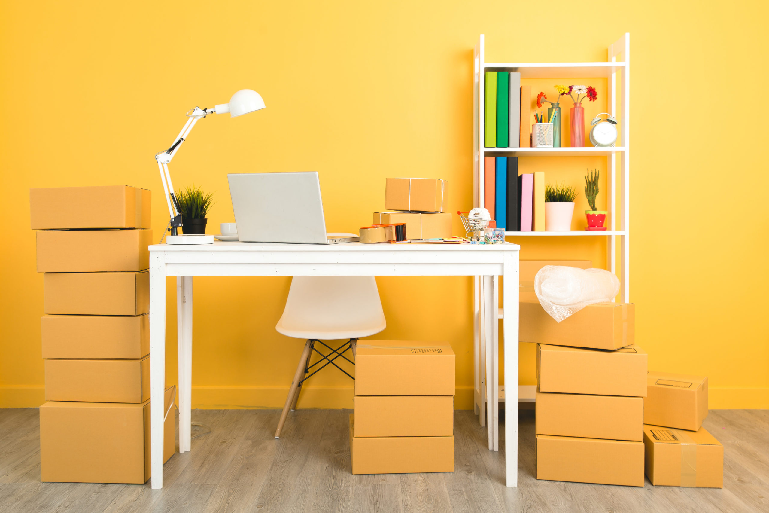 business owner working at home office packaging on background.